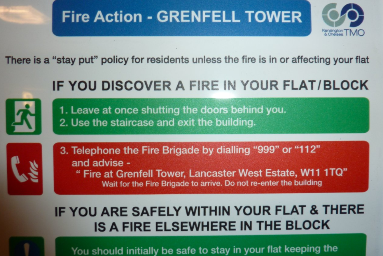 A sign in the Grenfell apartment block said there was a "stay put" policy in the case of fire