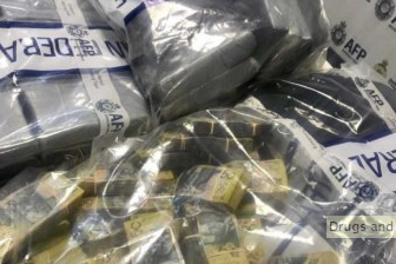 Police seized three duffel bags allegedly containing 78 boxes of cocaine and $580,000 in cash in separate raids. Photo: ABC news/Joanna Crothers