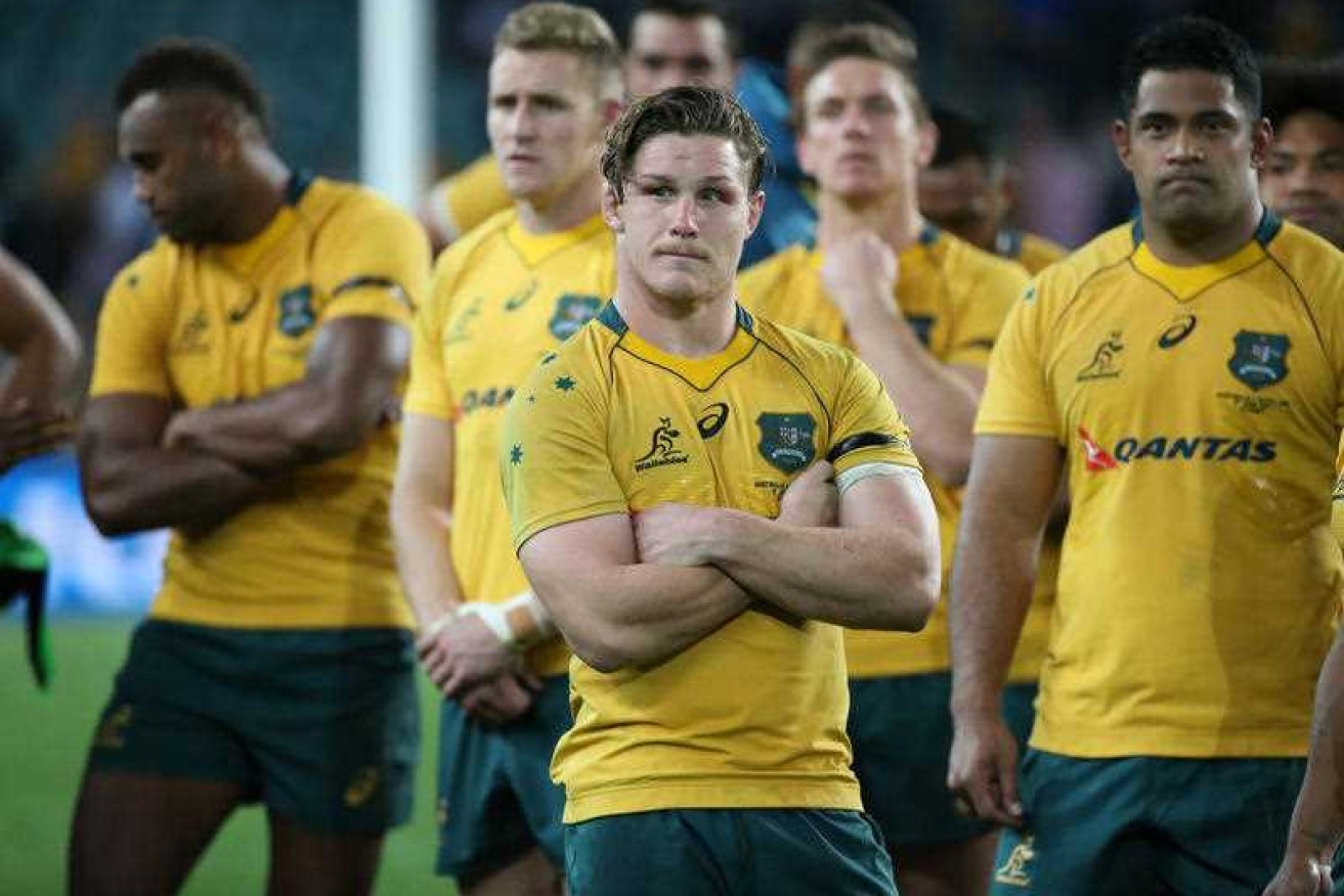 Michael Hooper and his Wallabies teammates look shattered after losing to Scotland.