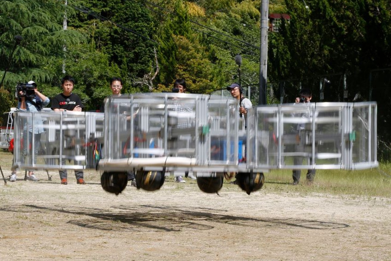 An unmanned model of the "flying car" that might, just might, light the Olympic fire takes to the air in Japan.