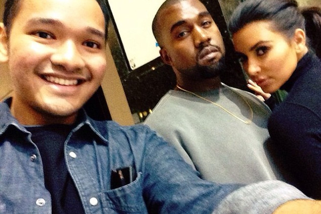 A fan snaps a selfie with the surprisingly friendly Kanye West and Kim Kardashian in Melbourne.