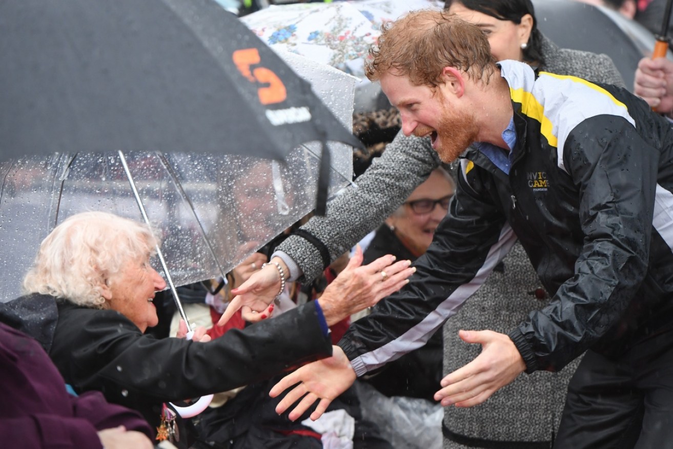 Prince Harry greets one of his more senior fans in Sydney.