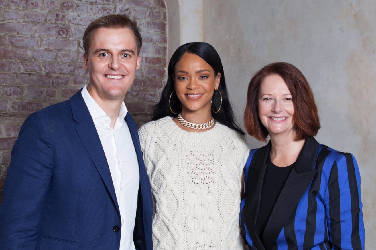 Julia Gillard and Rihanna are pictured together with humanitarian Hugh Evans