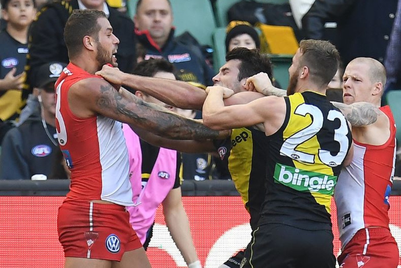 Push comes to shove as Sydney's Lance Franklin the Tigers' Zak Jones square off in a spiteful game at the MCG.