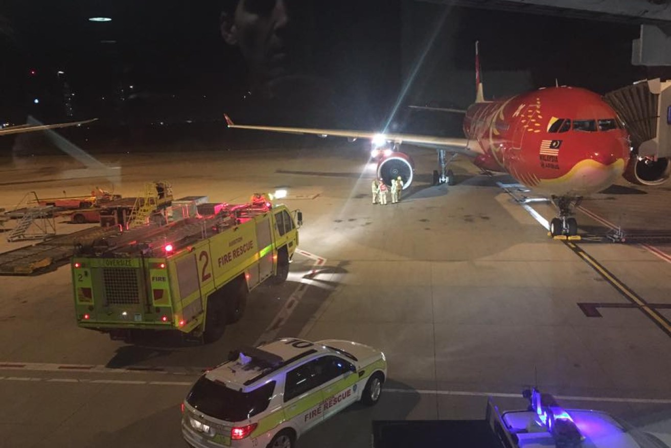 An Ariasia X flight to Malaysia was forced to land in Brisbane after apparently hitting a bird.