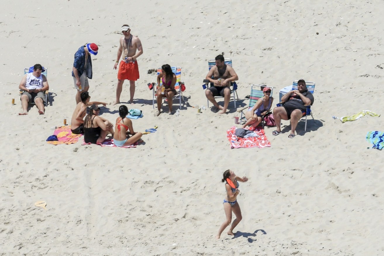 New Jersey governor Chris Christie uses the beach with his family and friends after closing it off from the public.