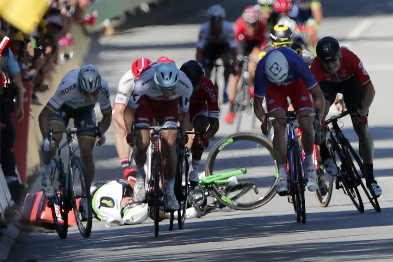 World champion Peter Sagan was disqualified from Tour de France for causing a crash in a chaotic sprint finish.