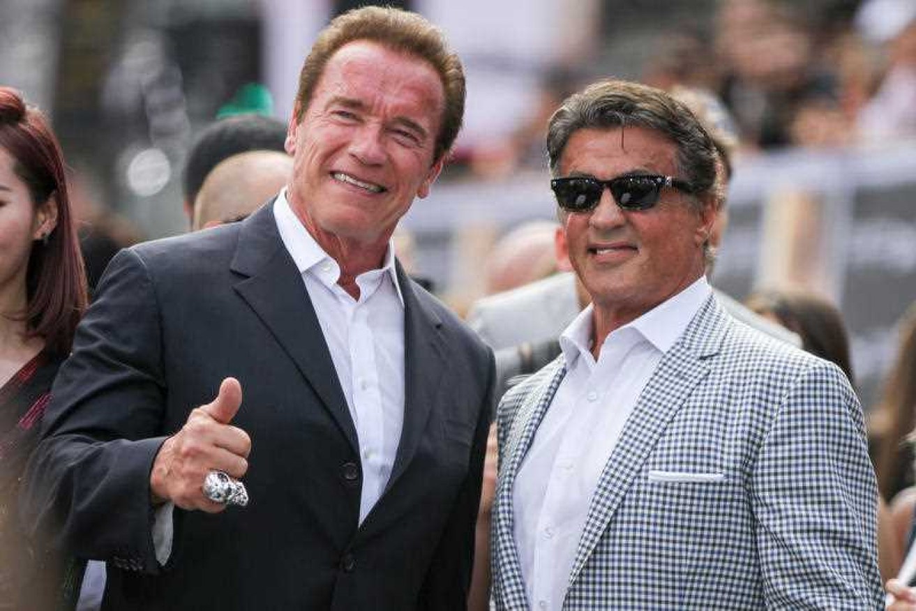 Arnold Schwarzenegger and Sylvester Stallone at a movie premiere in 2015.