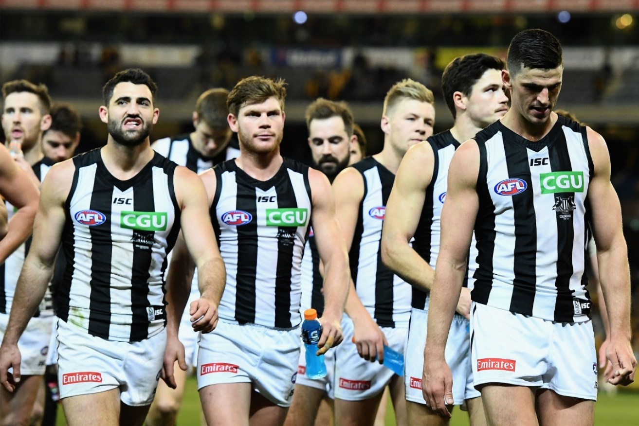Collingwood have fallen to 15th on the AFL ladder after going down to Hawthorn by 24 points at the MCG.