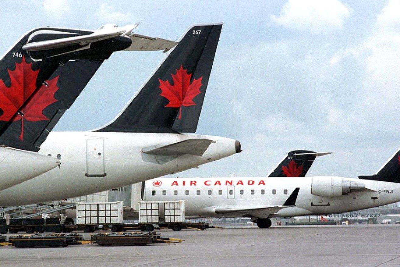 An Air Canada pilot almost landed on the wrong strip and could have crashed into four full passenger planes waiting for take-off on the taxiway