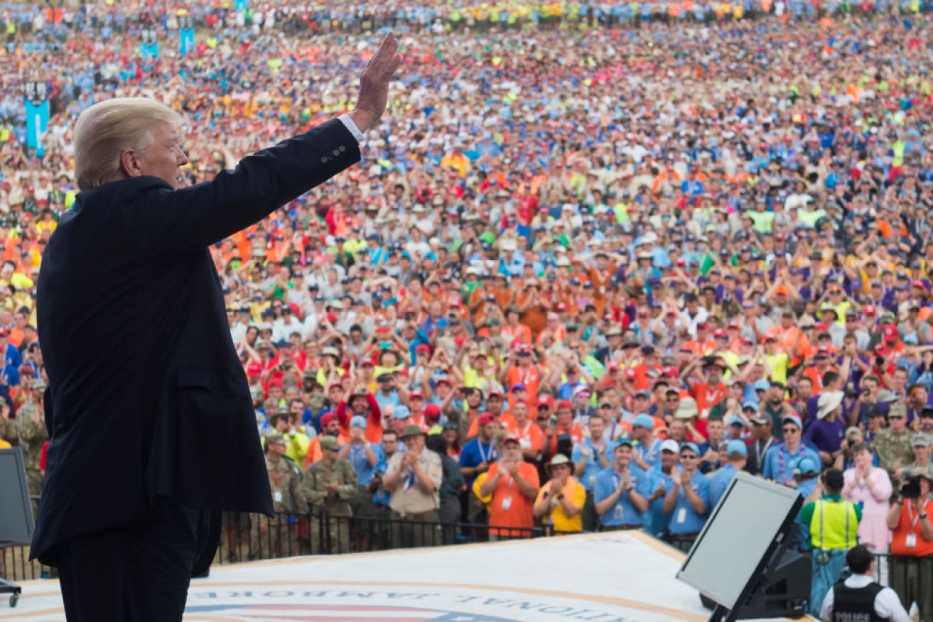 President Donald Trump has addressed 40,000 boy scouts, who booed "fake news"