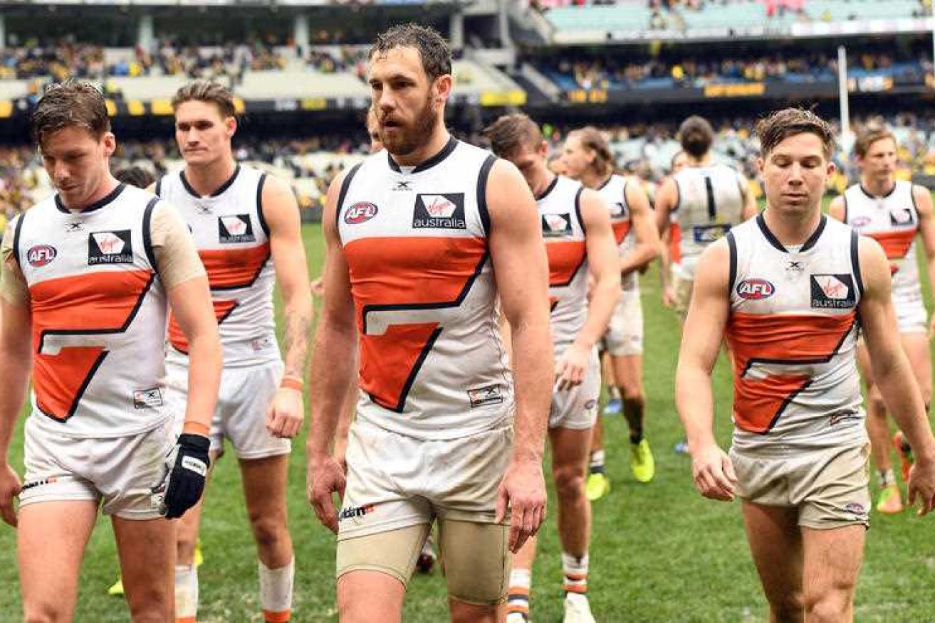 The Giants trudge off the field after losing to Richmond at the MCG.