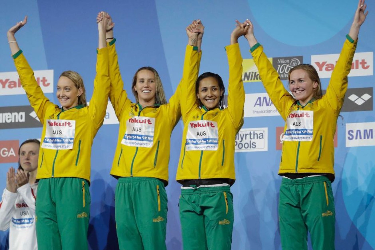 A blistering anchor leg by Ariarne Titmus (right) secured bronze for Australia.