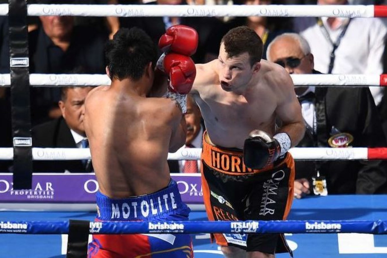 Jeff Horn bores in against a stunned Manny Pacquiao in Brisbane.