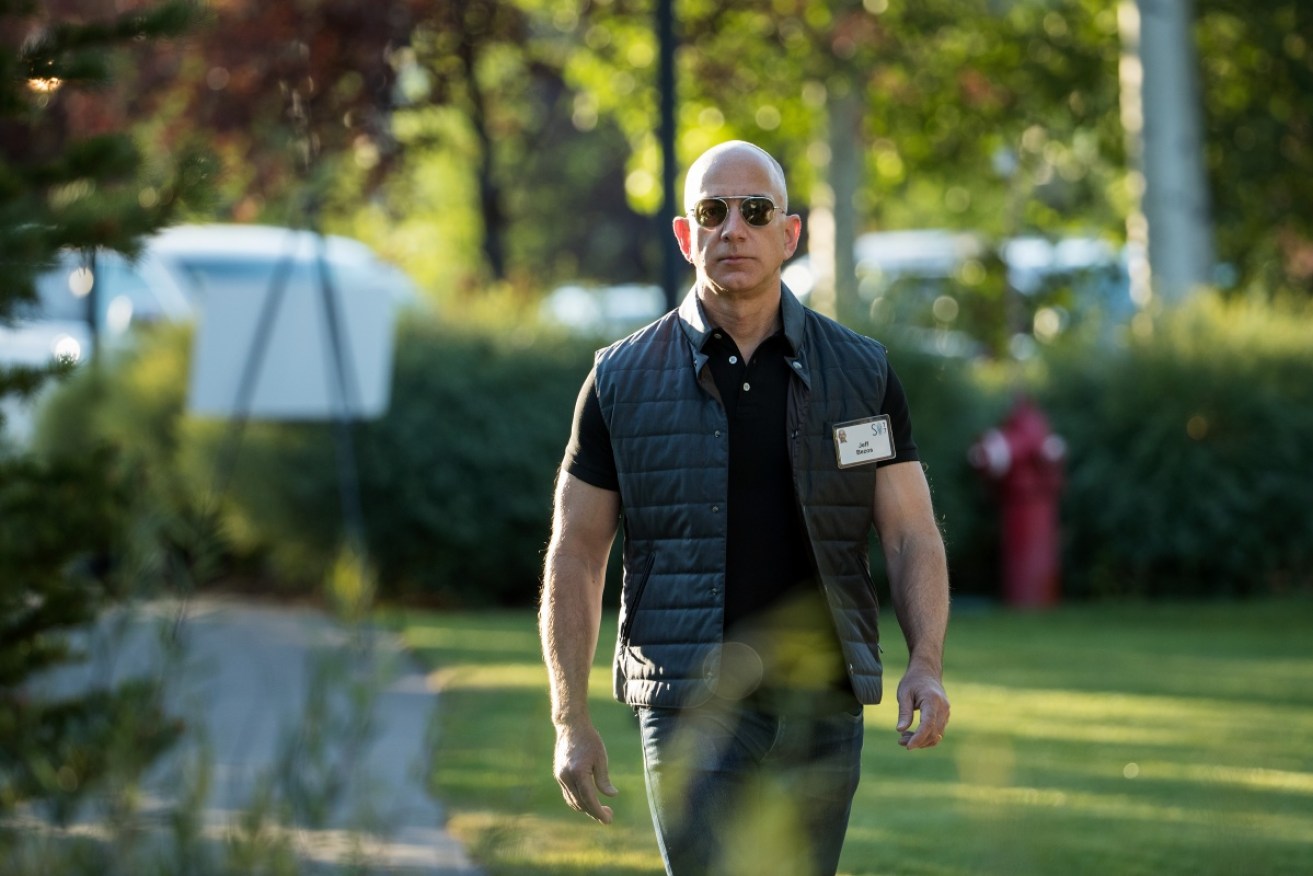 The Amazon boss arrives at an exclusive conference looking like  an action film star.