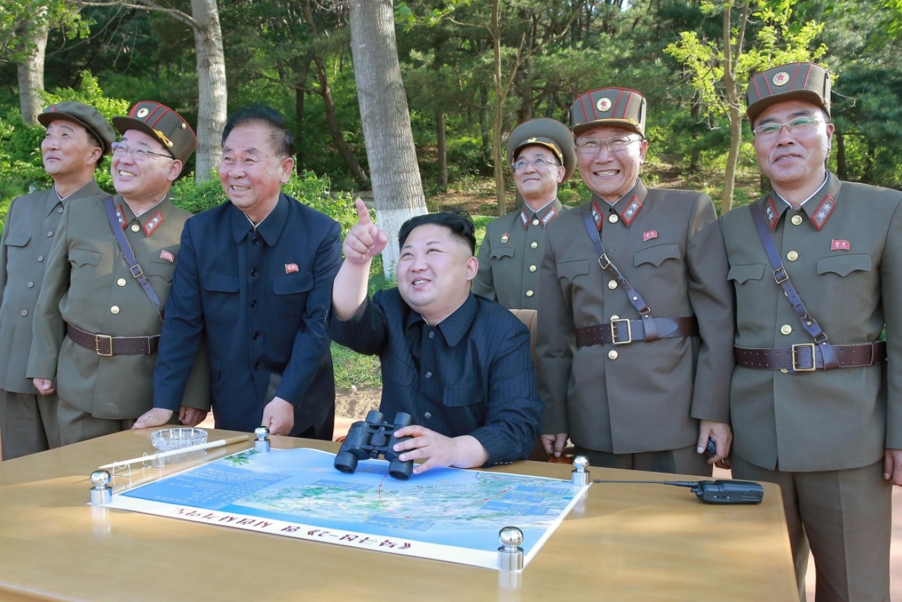 Kim Jong-Un, shown here celebrating an earlier missile test, has responded to US military exercises with another launch. <i>Photo: EPA</i>