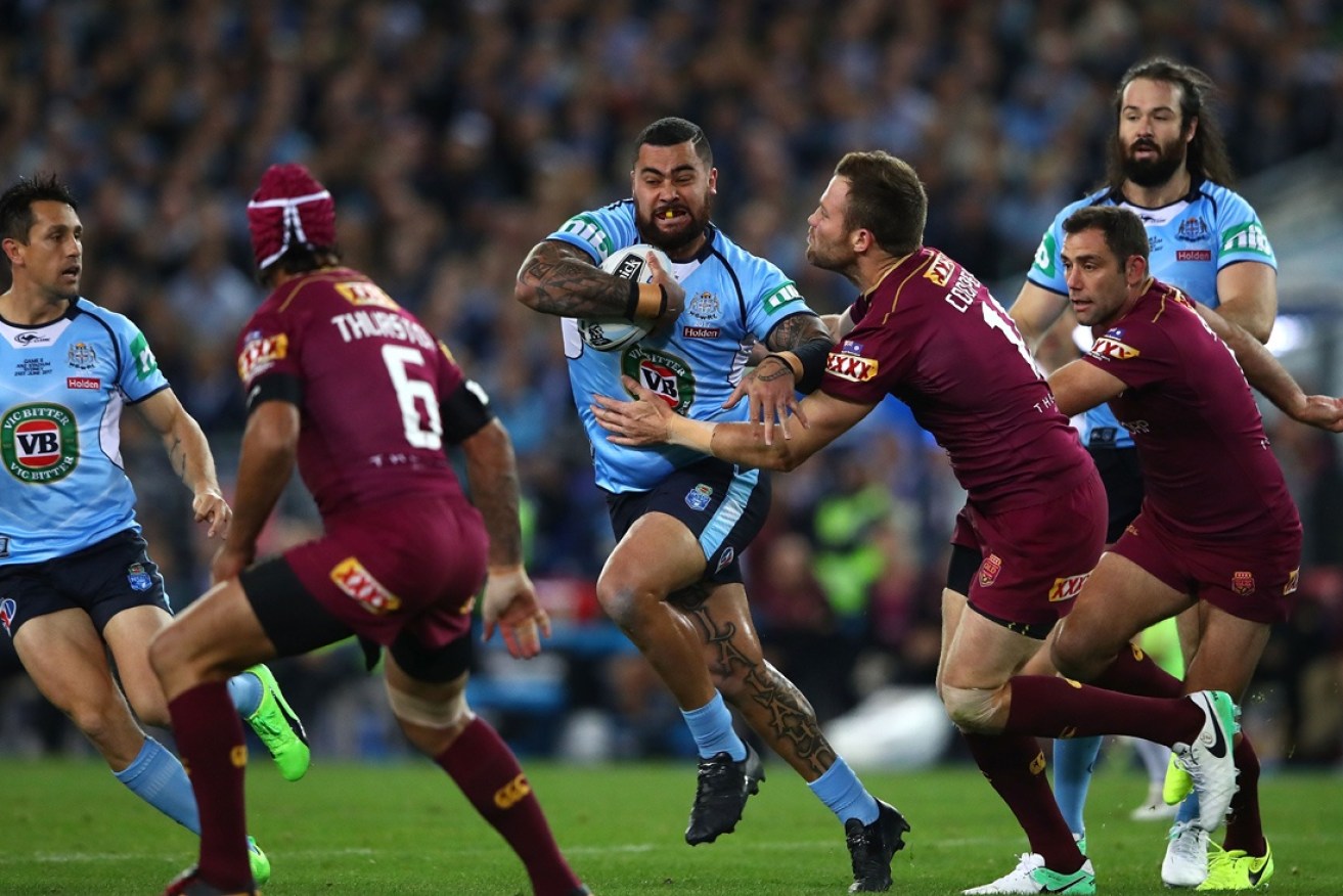 Andrew Fifita goes on a run.