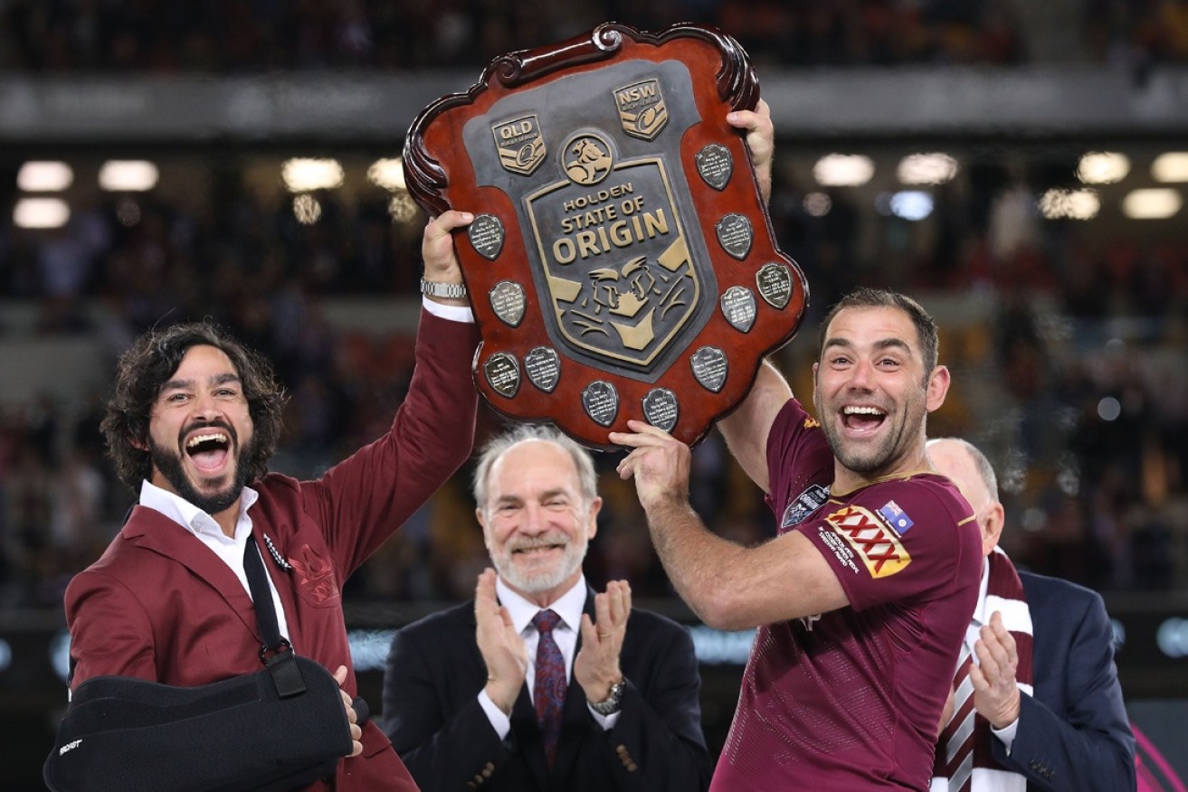 Johnathan Thurston and Cameron Smith celebrate Queensland's win.