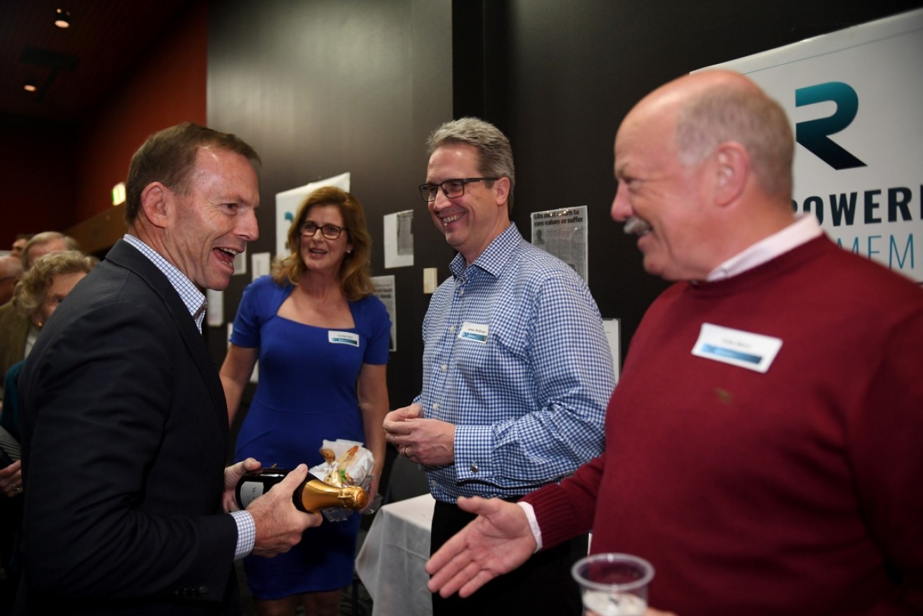 Tony Abbott chews the fat with voters during his Liberal Party Democratic reform event.