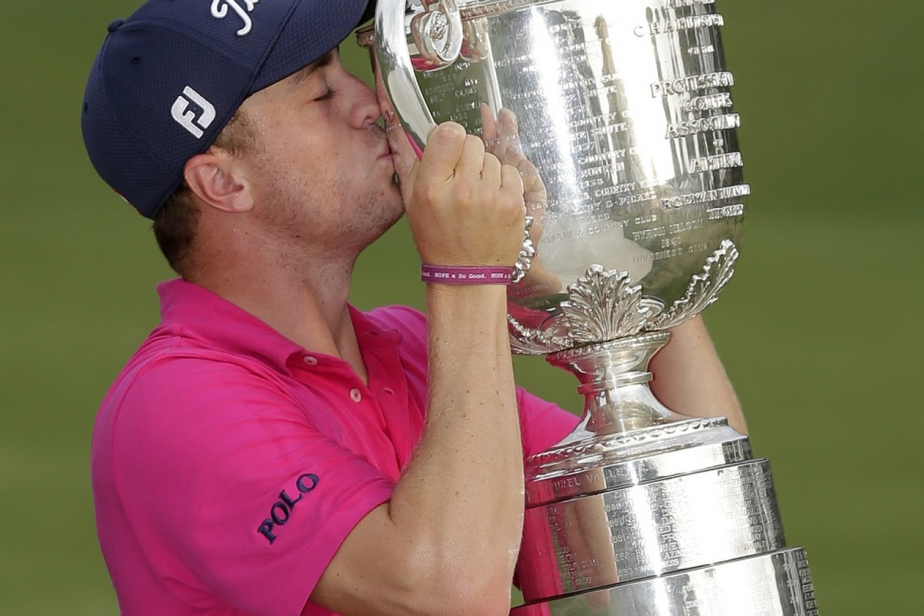 Justin Thomas poses with the Wanamaker Trophy after winning the PGA Championship golf tournament in Charlotte.