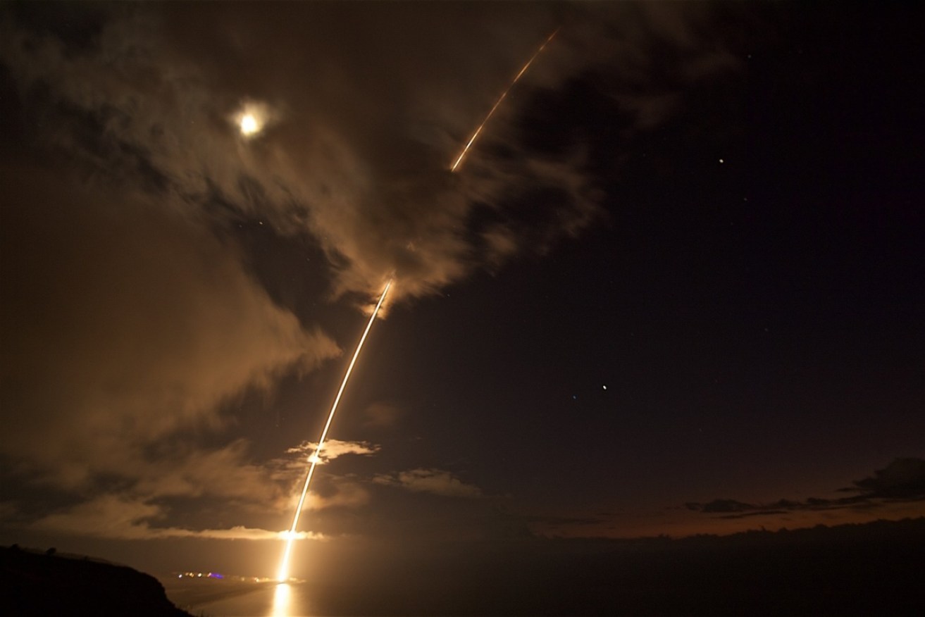 The US conducts its own missile test in the Pacific as a show of force to North Korea.