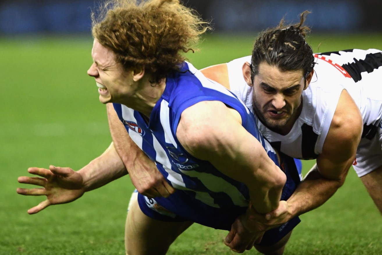 Brodie Grundy's tackles on Ben Brown has divided the footy world.