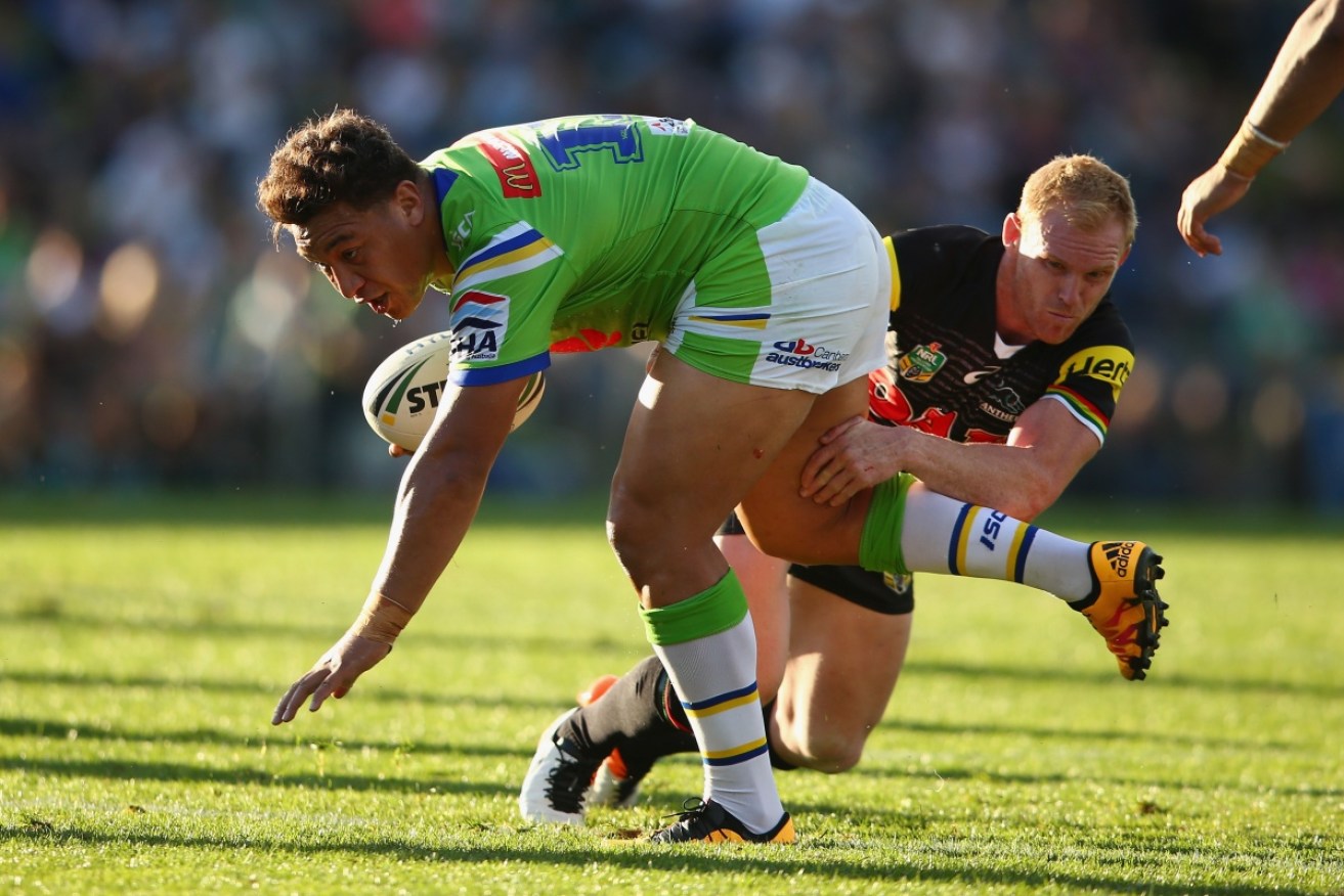 Going nowhere: Josh Papalii of the Raiders is stopped short by Peter Wallace of the Panthers. 