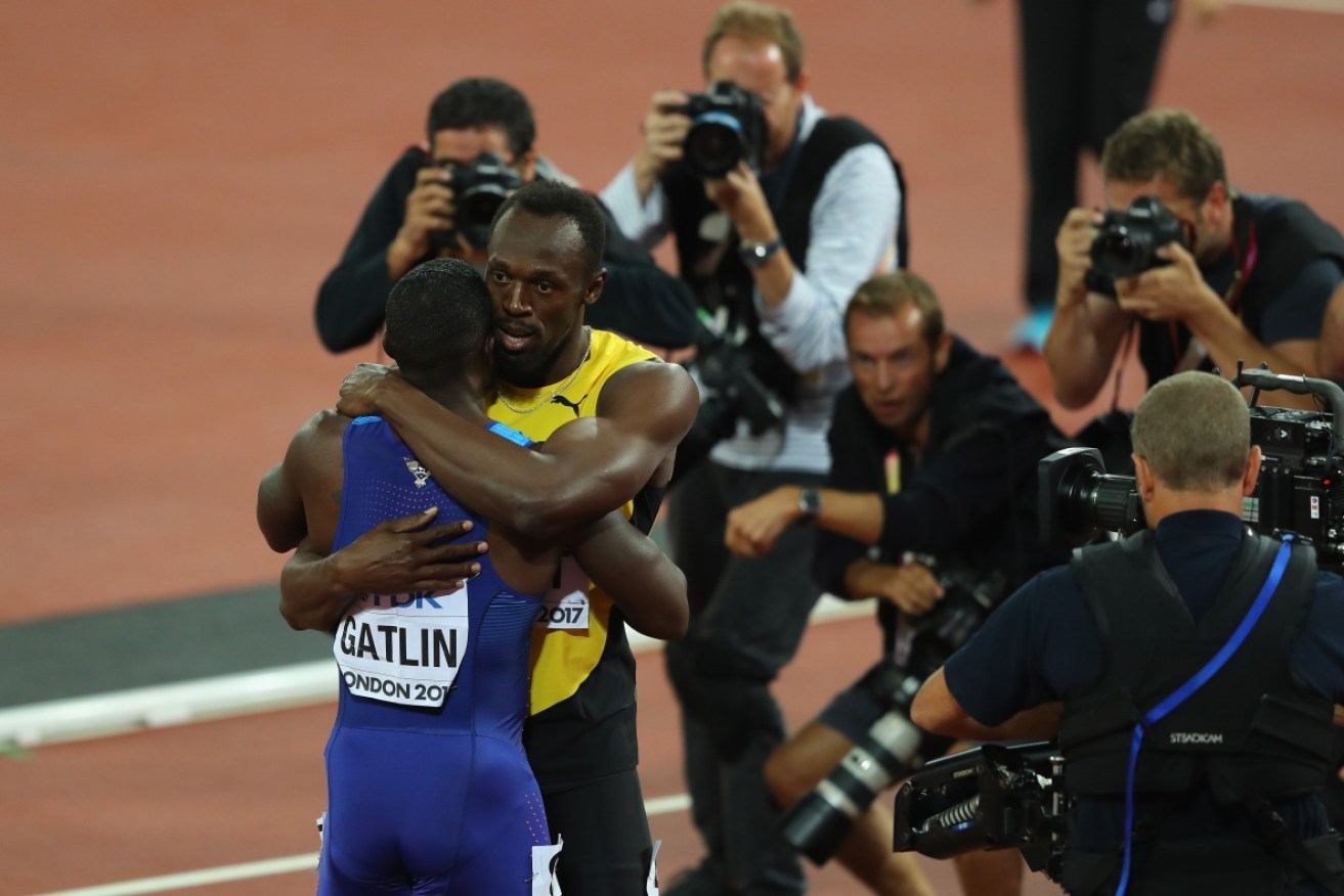 After coming third in his final 100m race Usain Bolt (R) and winner Justin Gatlin embrace. 