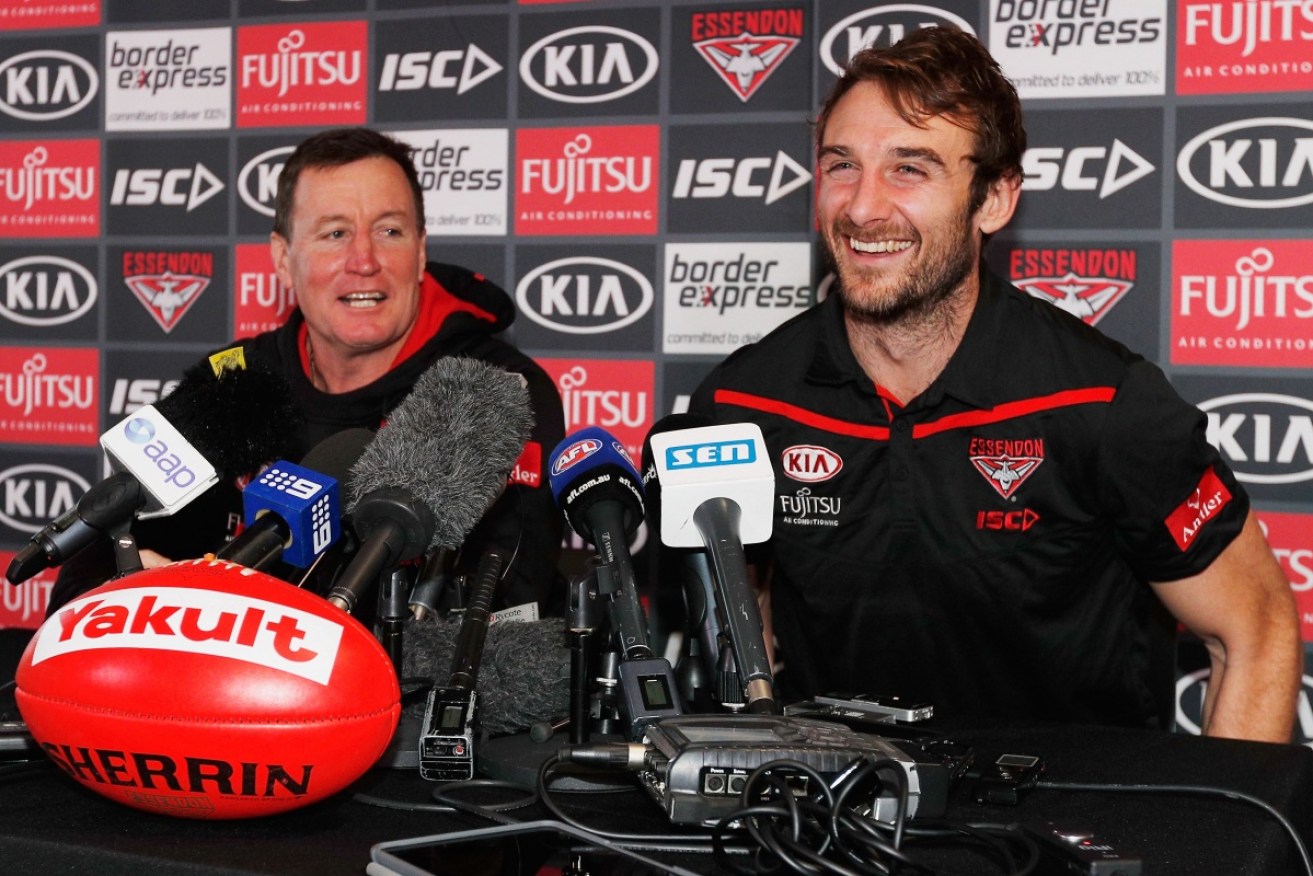 Essendon coach John Worsfold (L) and Jobe Watson at the media conference where the Bomber champ announced his retirement. 