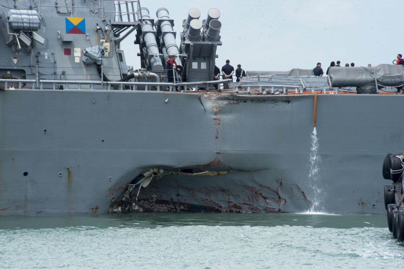 The damage to the side of the USS John S. McCain.   