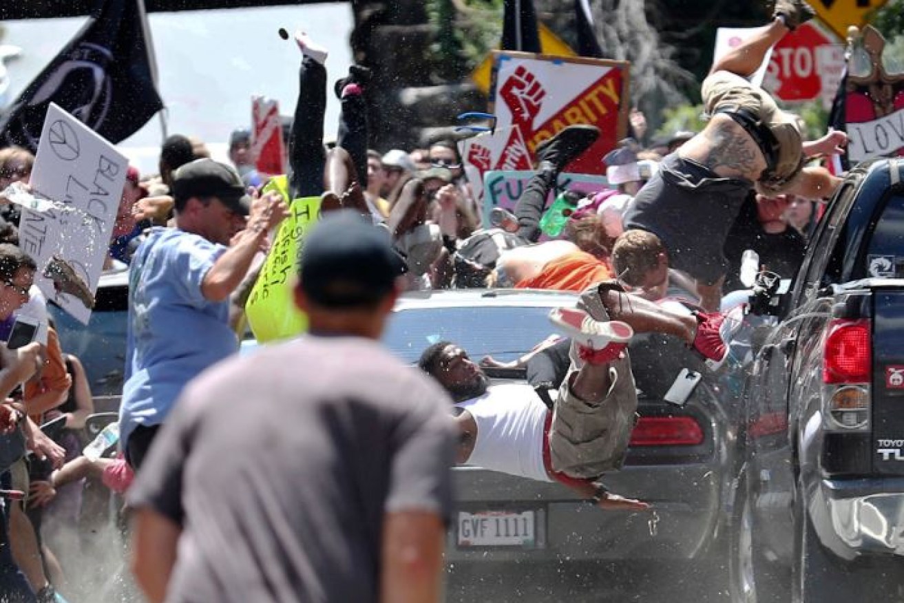 Protesters fly through the air like rag dolls as the car ploughs through the anti-racist crowd in Charlottesville.