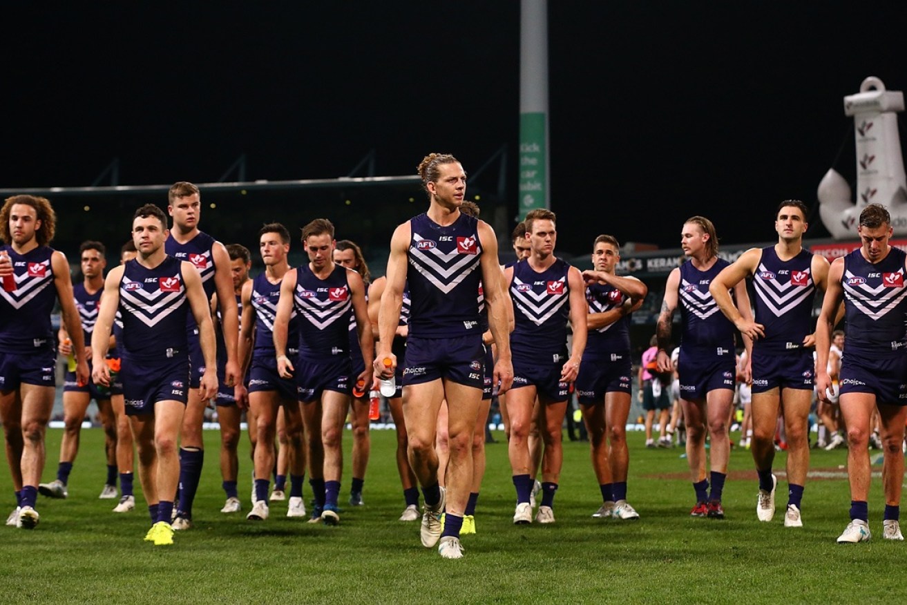 Fremantle trudge off Subiaco after a disappointing defeat.