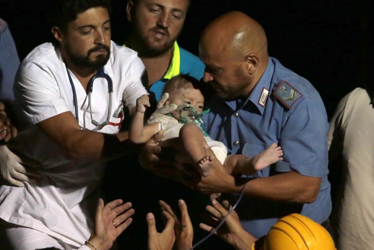 One of three brothers is rescued after an earthquake on Italian resort island of Ischia.