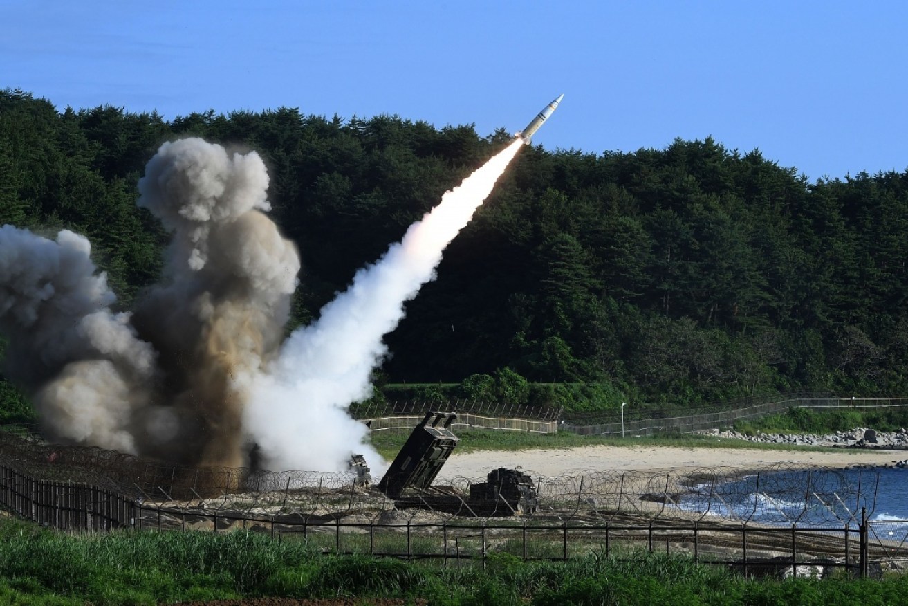 North Korea has fired a missile over Japan, which broke into pieces and fell into waters off Hokkaido.