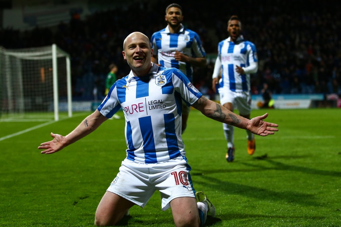 Aaron Mooy celebrates a goal for Huddersfield.