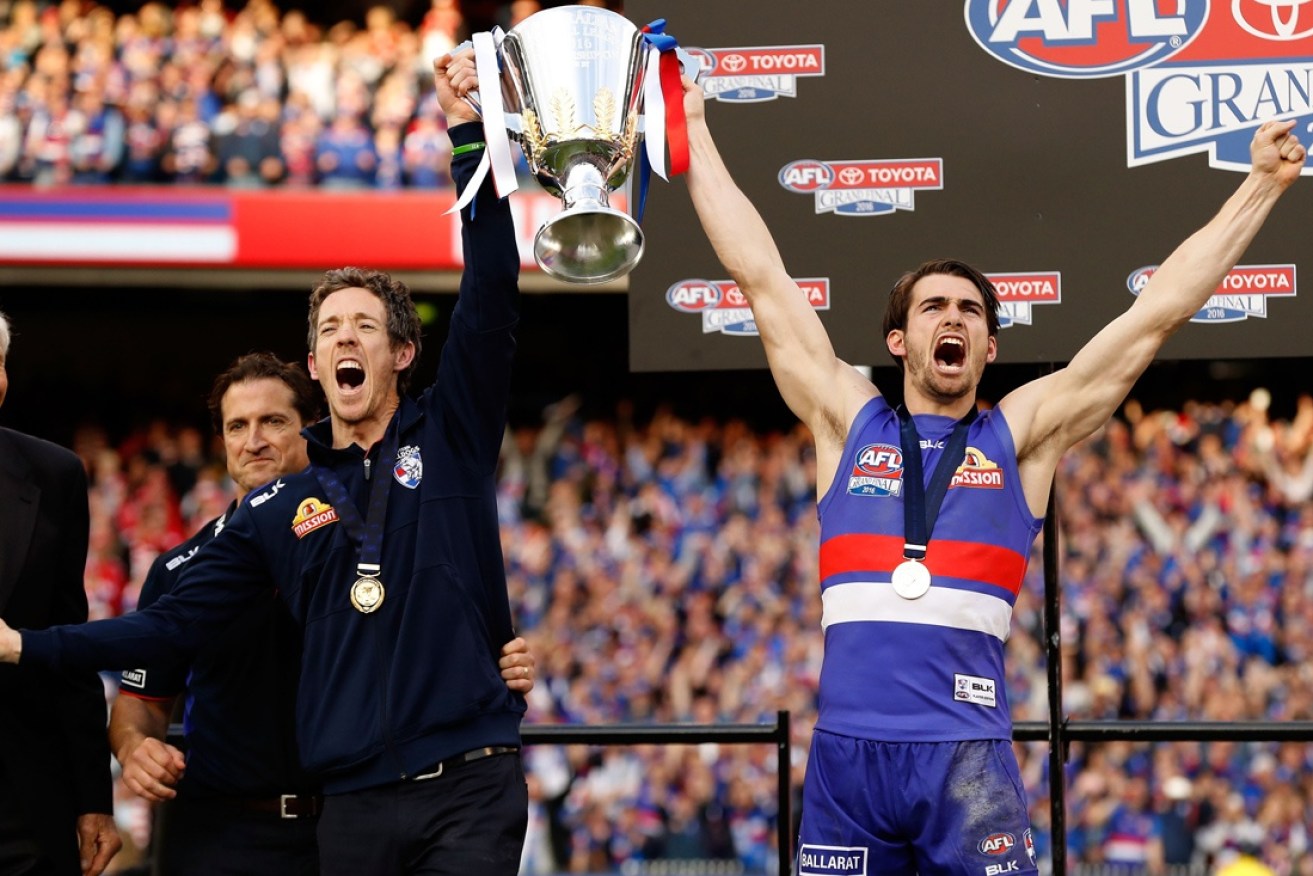 Murphy and Easton Wood celebrate after the 2016 AFL Grand Final.