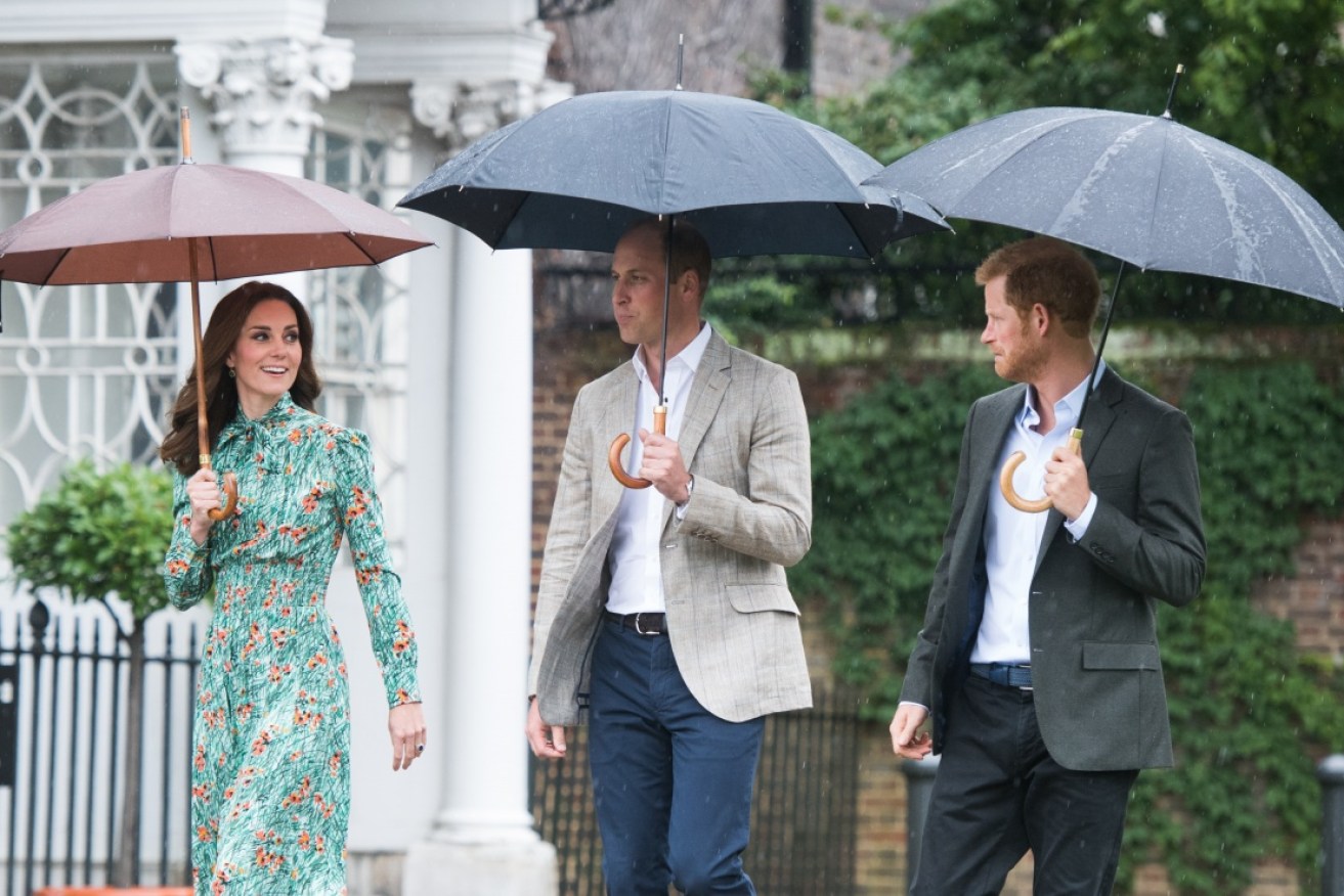 Thanks, team: the Duke and Duchess of Cambridge with Prince Harry at Kensington Palace on August 30.