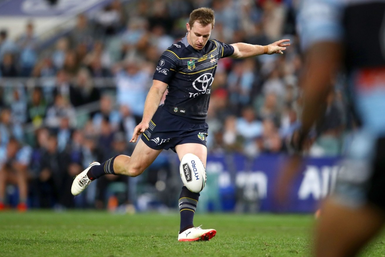 The Cowboys' Michael Morgan takes a kick in the NRL final against Cronulla. 
