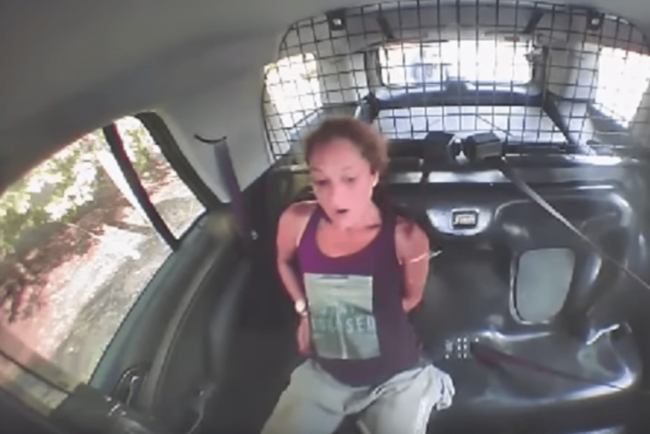CCTV footage shows Texas woman escaping out of handcuffs and driving away in police car.