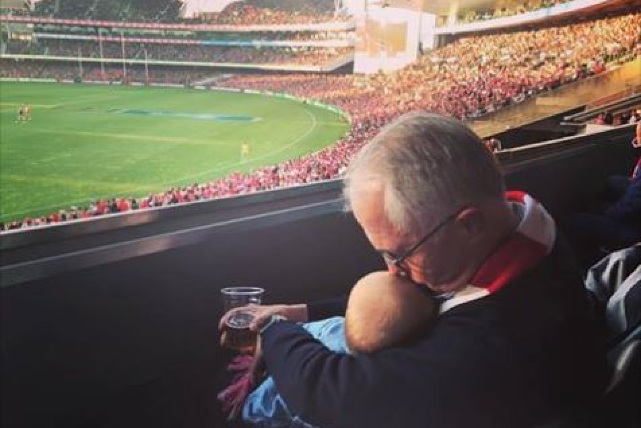 What's all the fuss about? A tweeted picture of Malcolm Turnbull and his grandchild prompted a ludicrous social media debate about holding a baby while drinking a beer at the football. Most saw the photo for what it was, a tender moment.