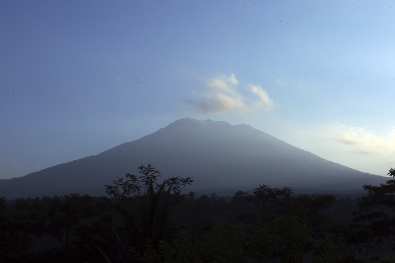 Smoke and ash soar above Bali's restless Mount Agung volcano.