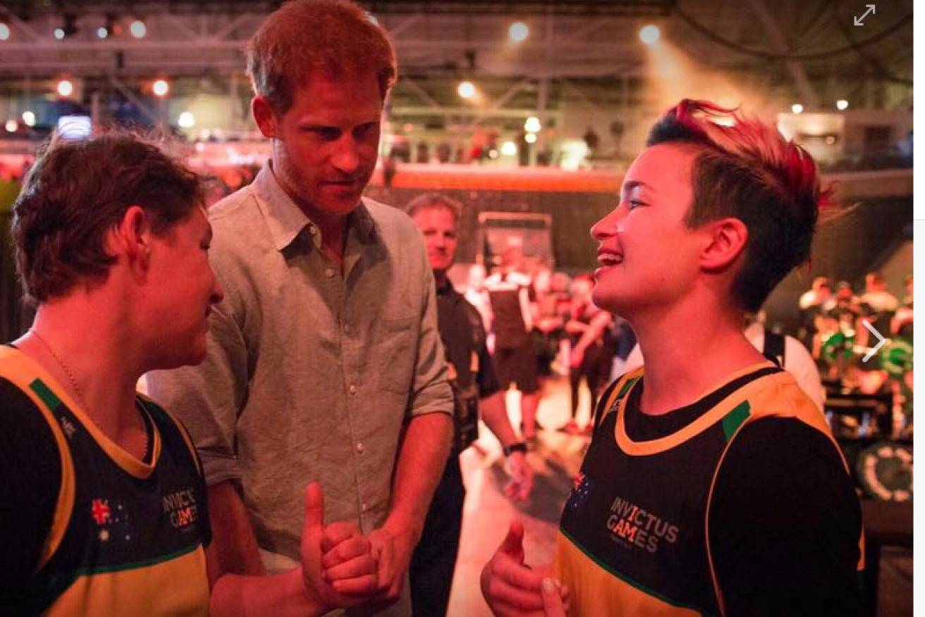 Michaela Gilewicz (R) meets Prince Harry at the Invictus Games. 