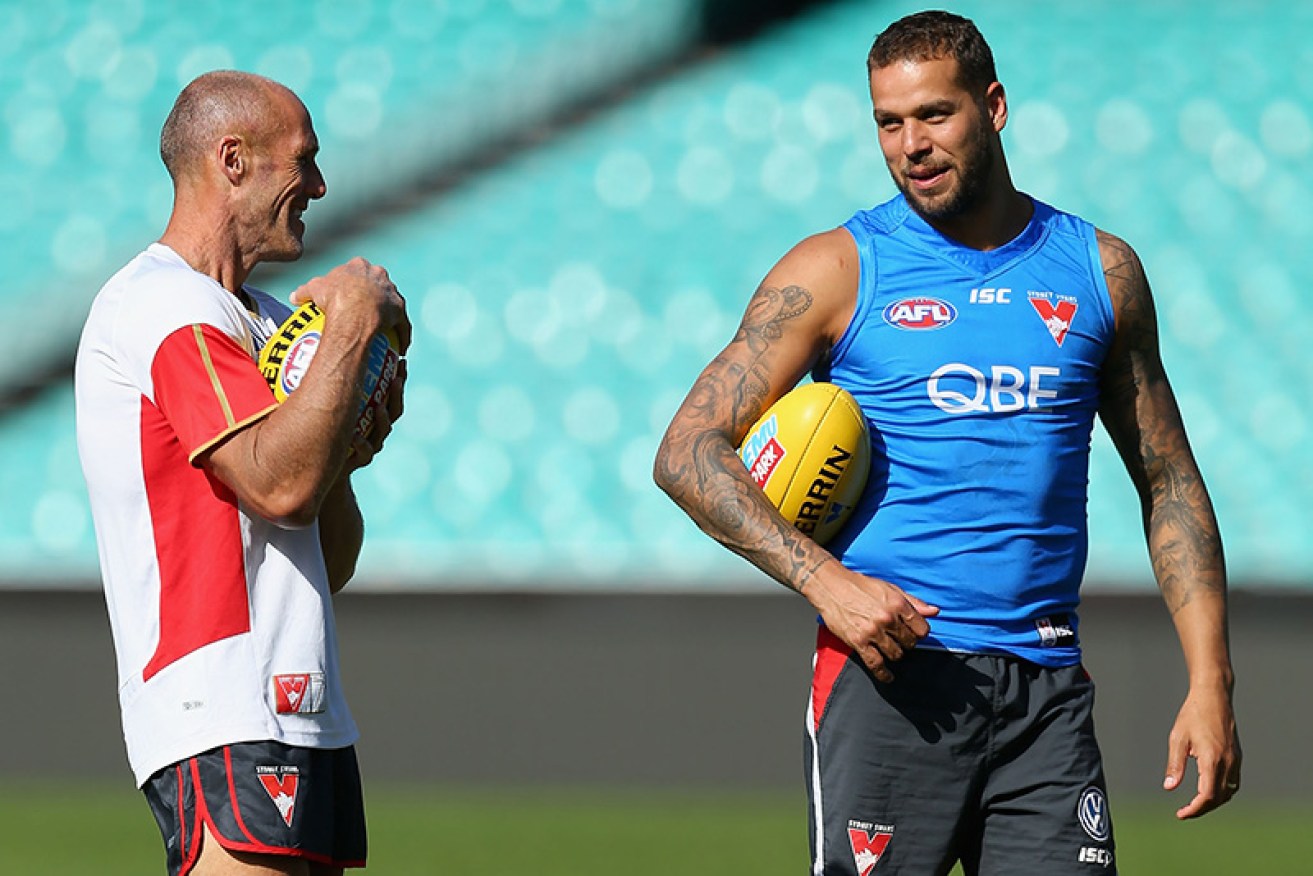 The AFL's leading goalkicker of all time Tony Lockett speaks with Swans star Lance Franklin at training.