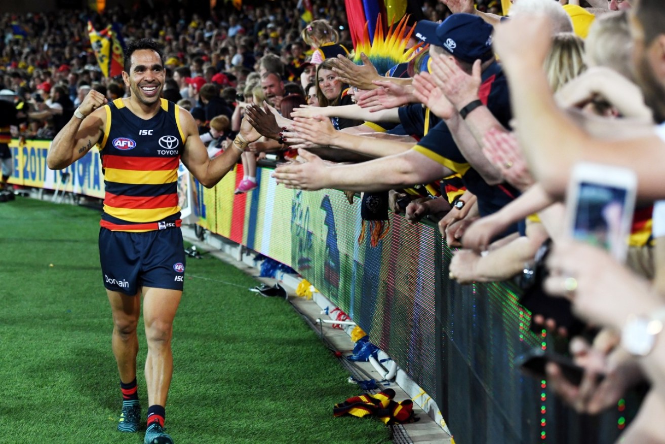 Adelaide superstar Eddie Betts greets fans after another on-field success. 