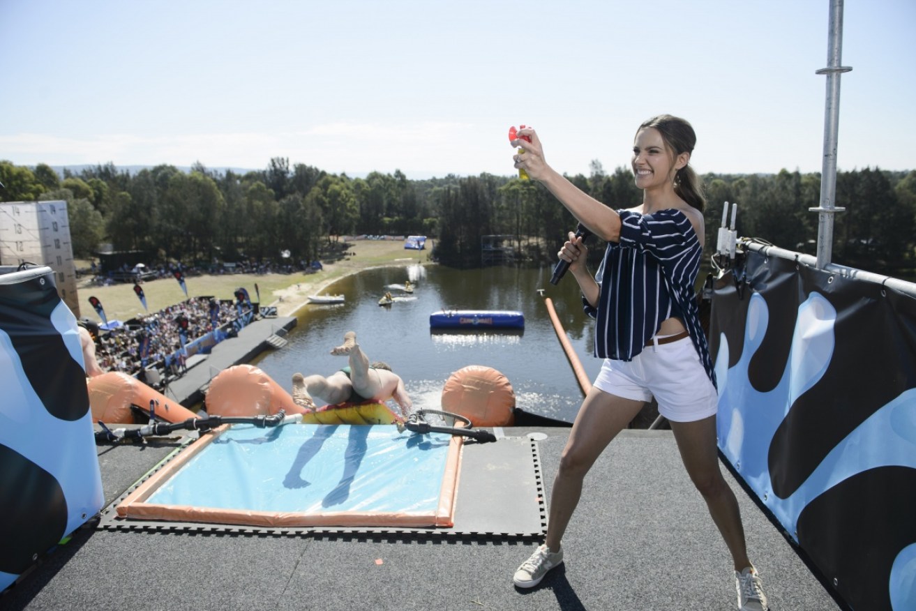 Host Rachael Finch encourages competitor to face their fears on <i>Cannonball</i>.
