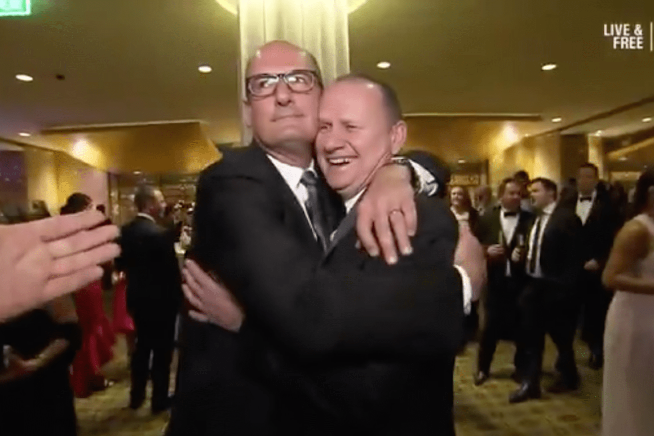 Port Adelaide's chairman David Koch embraces coach Ken Hinkley at the Brownlow.