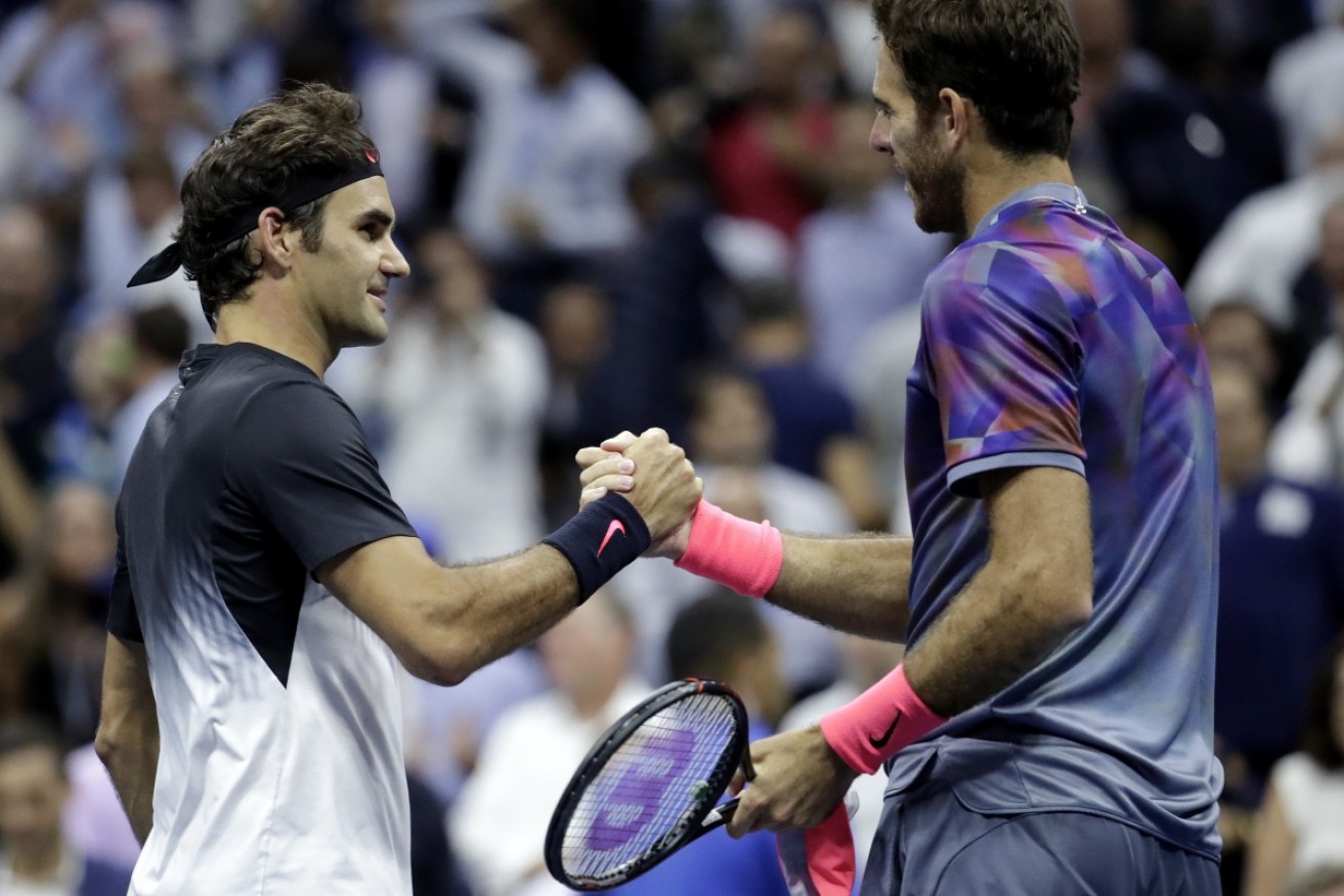 Roger Federer (L) and Juan Martin del Potro shake hands after their quarterfinal match.