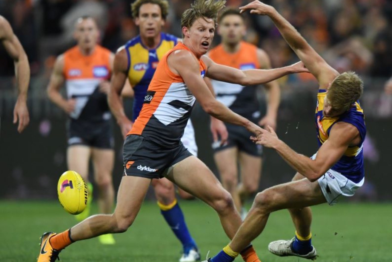 Lachie Whitfield of the Giants tosses Eagle Brad Sheppard aside late in the game.