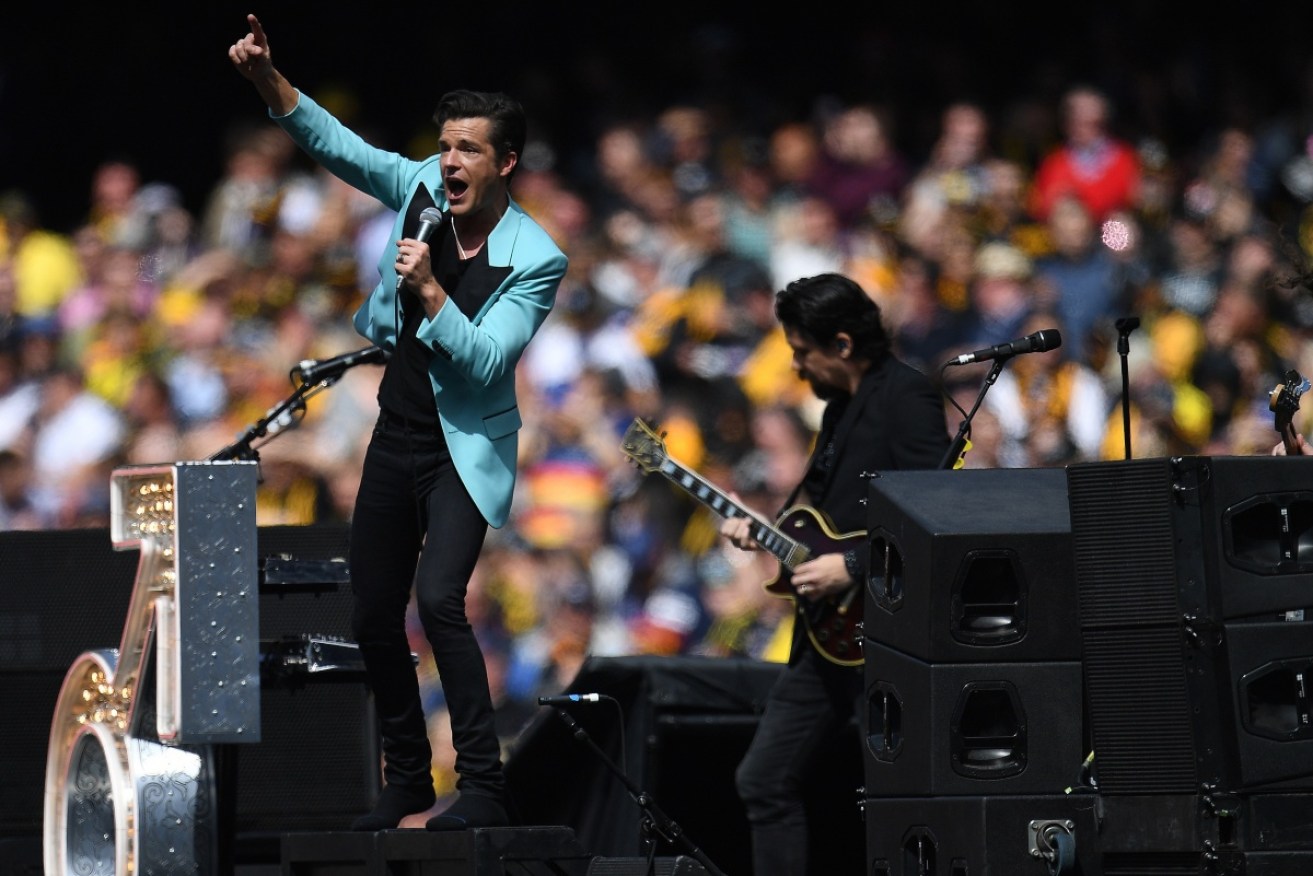 The Killers' lead singer Brandon Flowers may not know much about AFL, but he knows how to work a crowd.