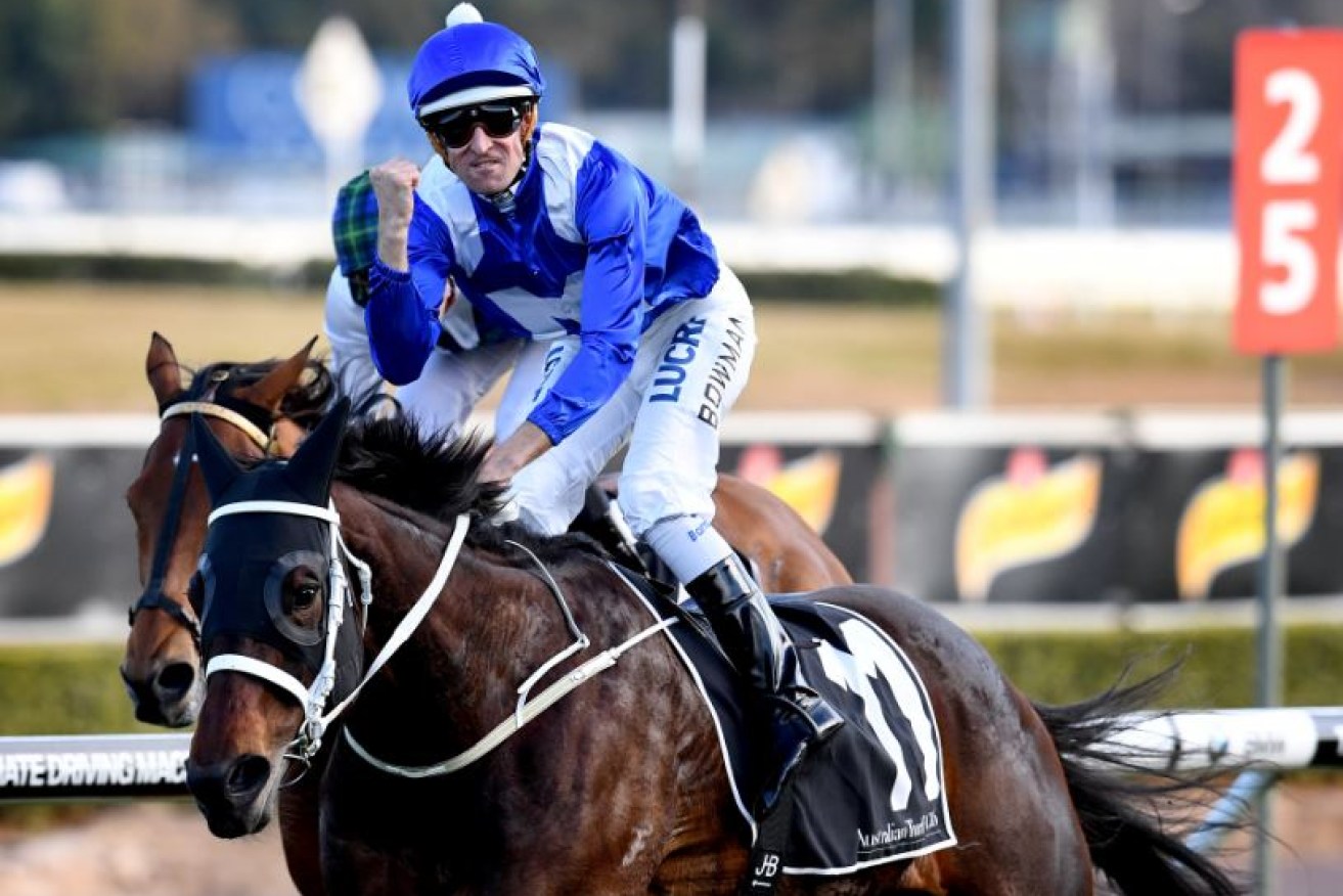 Jockey Hugh Bowman raises a triumphant first as mighty mare Winx adds the Chelmsford Stakes to her growing tally of wins.